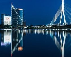 View of the Vanšu bridge and the Swedbank headquarters as seen from the waterfront at night